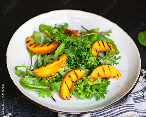grilled peach salad lettuce leaves mix nectarine ingredient natural product serving size top view copy space for text keto or paleo diet raw