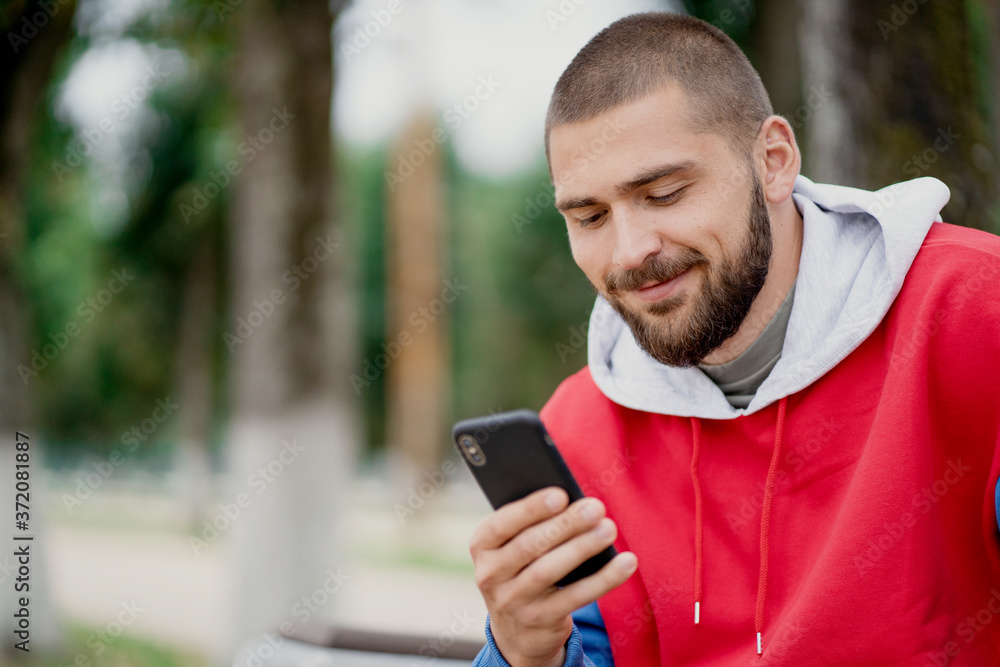young man using mobile phone young man using mobile phone