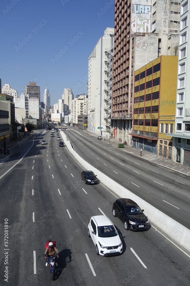 Sao Paulo cityscape: vehicles traffic, city architecture, Prestes Maia avenue, downtown