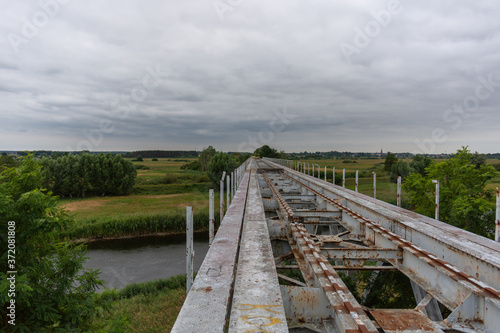 Abandoned  high railway bridge over the river