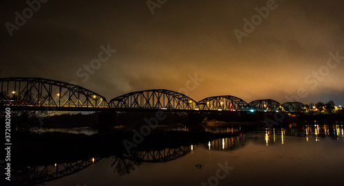 Bridge over Wisla river in Bydgoszcz city during night.