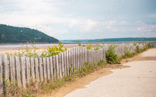 white fence on the beach
