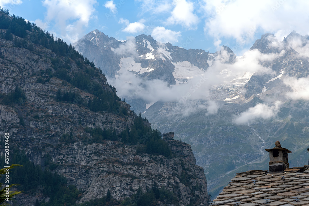 Roof of Courmayeur houses with a view of Mont Blanc - Valle d'Aosta - Italy