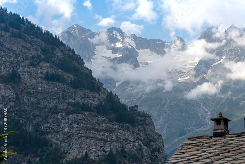 Roof of Courmayeur houses with a view of Mont Blanc - Valle d'Aosta - Italy
