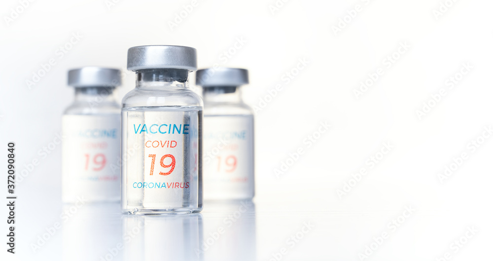 Obraz premium Closeup transparent vials with new vaccine for covid-19 coronavirus, flu, infectious diseases. Injection after clinical trials for vaccination of human, child, adult, senior. Medicine, drug concept