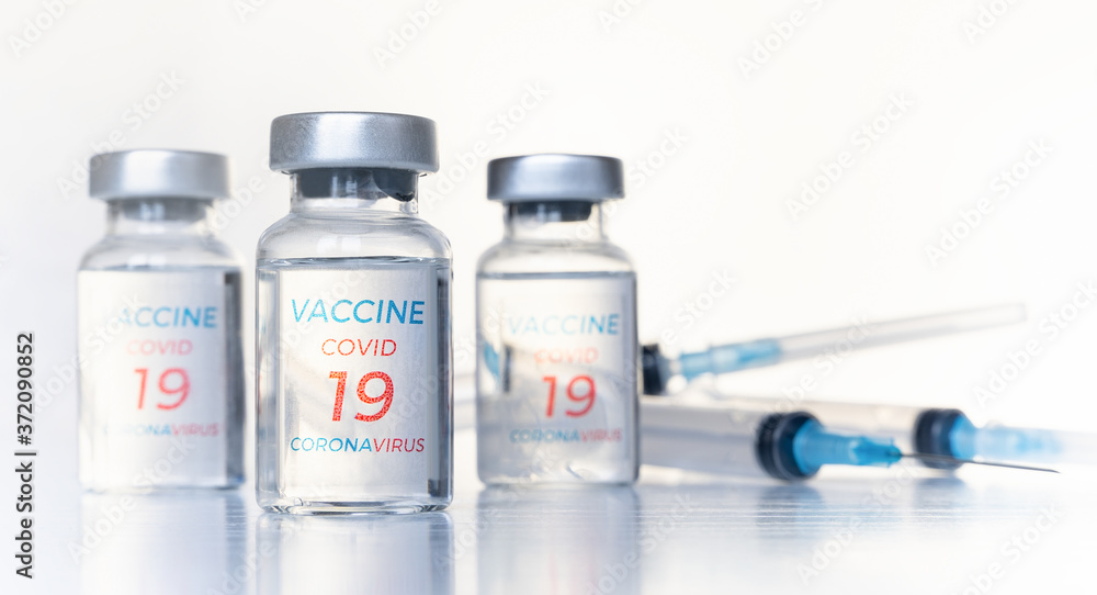 Transparent vials, syringes with new vaccine for covid-19 coronavirus, flu, infectious diseases. Injection after clinical trials for vaccination of human, child, adult, senior. Medicine, drug concept Transparent vials, syringes with new vaccine for covid-19 coronavirus, flu, infectious diseases. Injection after clinical trials for vaccination of human, child, adult, senior. Medicine, drug concept