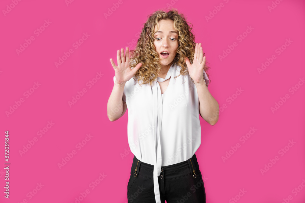Young woman expressing emotions, raised her hands up. Female portrait. Young woman expressing emotions, raised her hands up. Female portrait.
