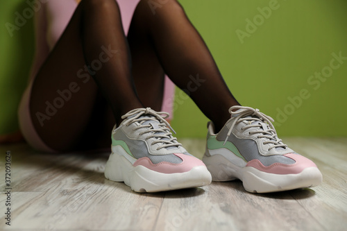 sneakers on female legs close up