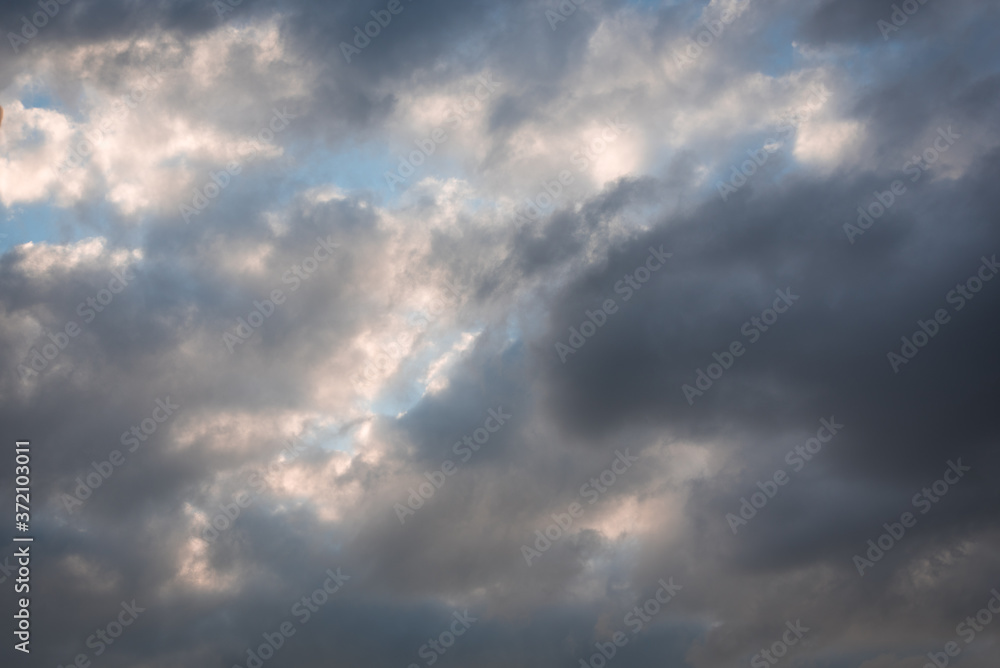 clouds and sunrays in summer 