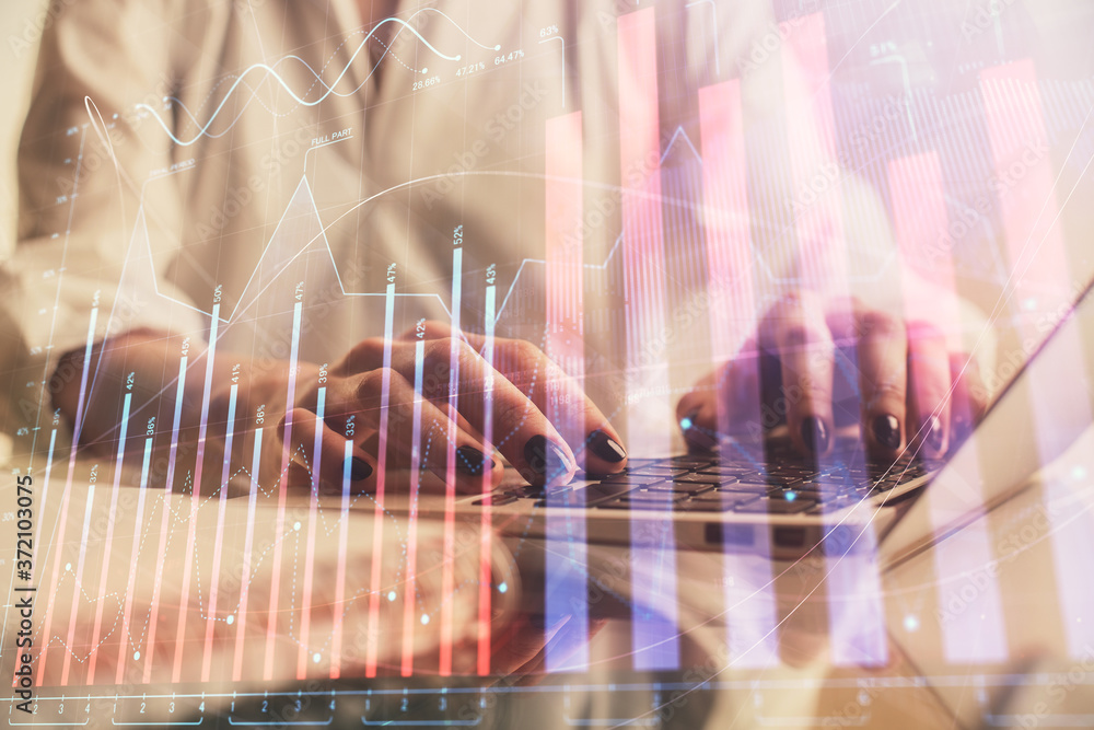 Double exposure of woman hands typing on computer and forex chart hologram drawing. Stock market invest concept. Double exposure of woman hands typing on computer and forex chart hologram drawing. Stock market invest concept.