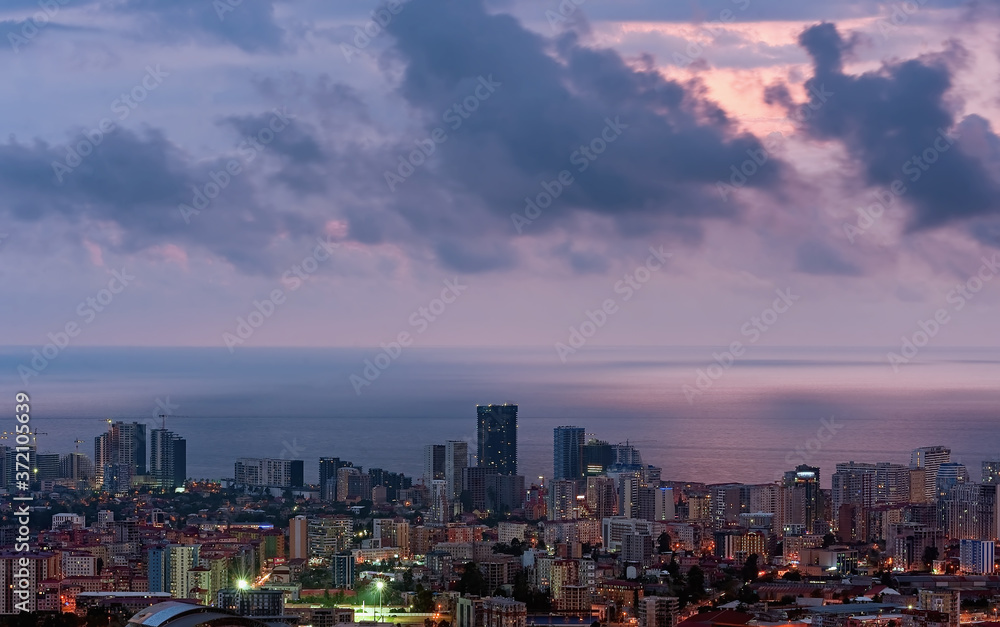 Cloudy aerial Batumi cityscape in Georgia at evening