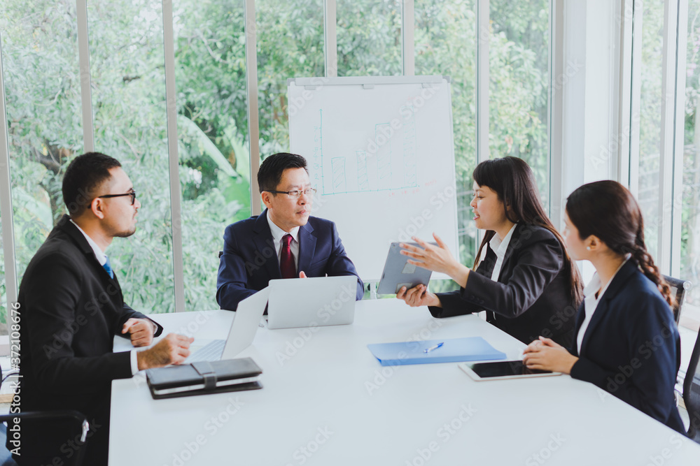 Asian company meetings for presentation as statistical graphs. The team of businessmen consulted about the marketing work in the meeting room of the workplace. Asian company meetings for presentation as statistical graphs. The team of businessmen consulted about the marketing work in the meeting room of the workplace.