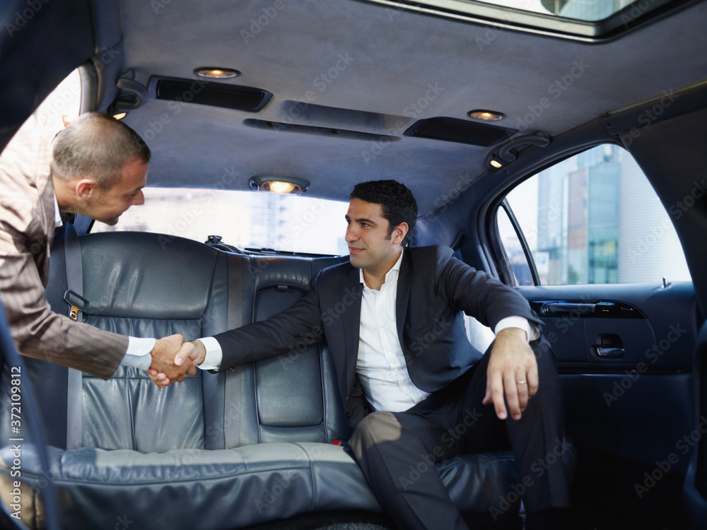 © Diego Cervo - Businessmen Meeting In Limousine And Shaking Hands © Diego Cervo - Businessmen Meeting In Limousine And Shaking Hands