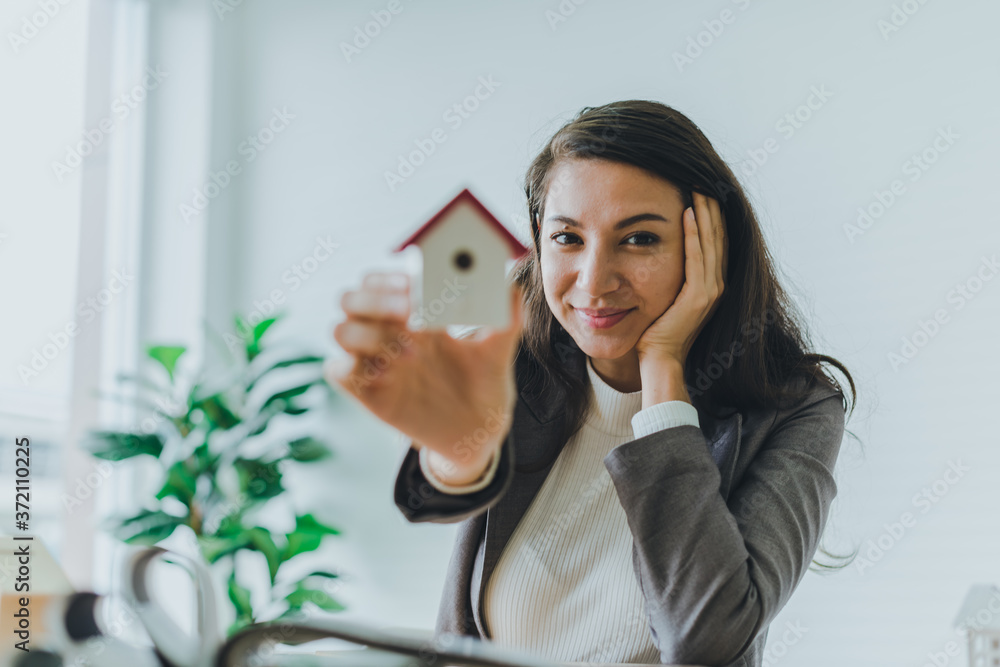 A beautiful young businessman working from home She is happy and relaxed at work.