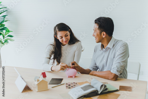 Asian couples, husbands and wives come together to design a house. To live together as a family in the future.