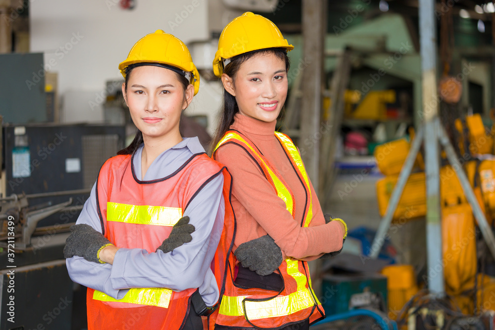 Portrait of Asian woman labor, They were wearing safety gear. Portrait of Asian woman labor, They were wearing safety gear.