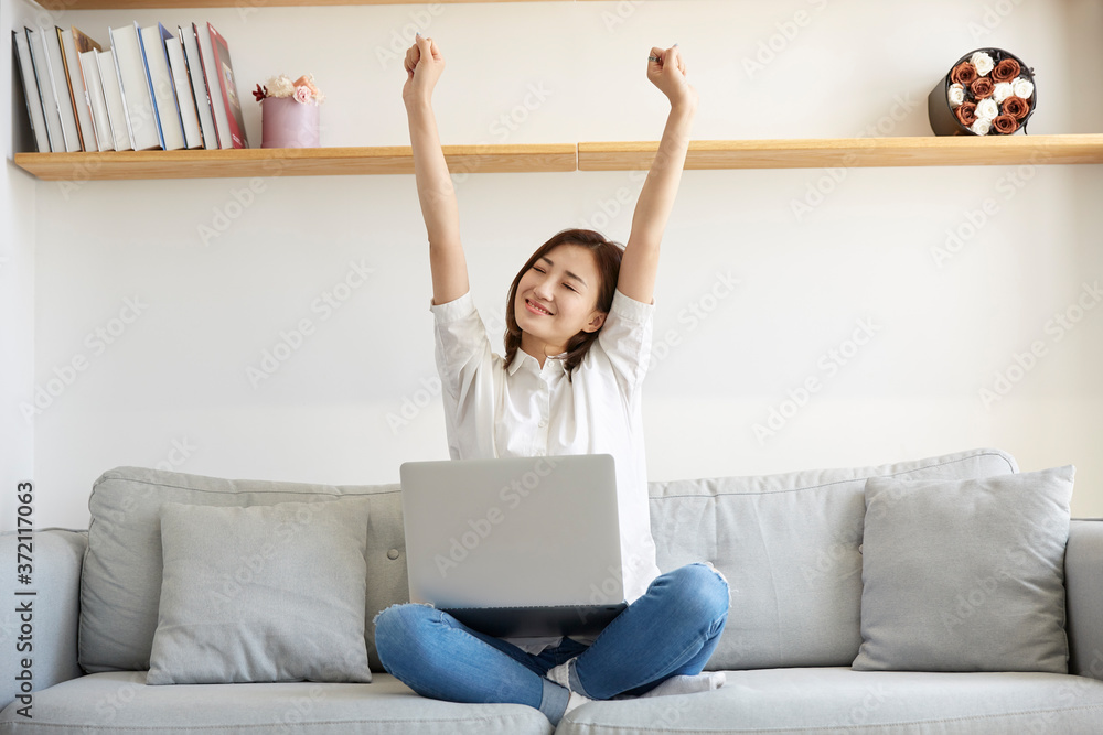 young asian businesswoman working at home using laptop young asian businesswoman working at home using laptop