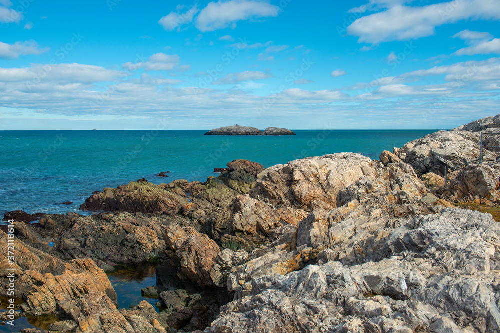 Rocky coast of Marblehead Neck near Marblehead lighthouse in Chandler Hovey Park in town of Marblehead, Massachusetts MA, USA. 