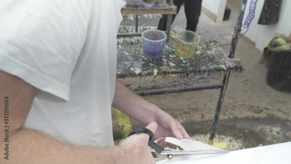slow motion jib crane down of surfboard being made epoxy fibreglass slow motion jib crane down of surfboard being made epoxy fibreglass