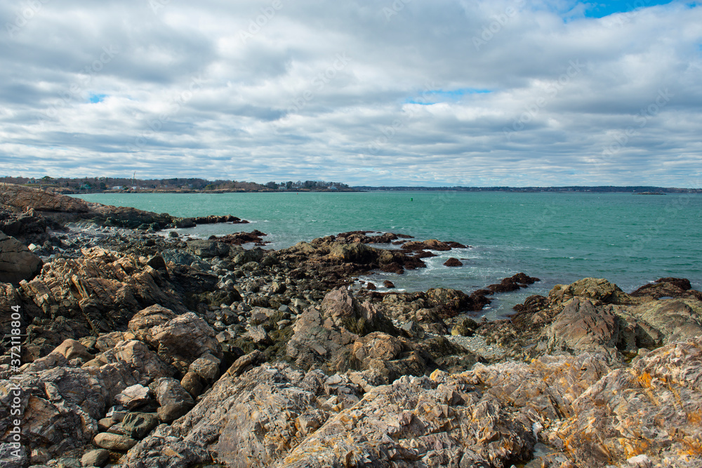 Rocky coast of Marblehead Neck near Marblehead lighthouse in Chandler Hovey Park in town of Marblehead, Massachusetts MA, USA. 