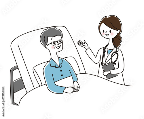 医者と話す入院患者