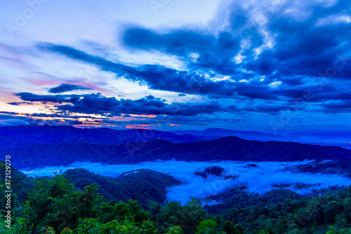Beautiful landscape with Misty morning sunrise at Doi Mon Ngao View point, Chiang mai in northern Thailand