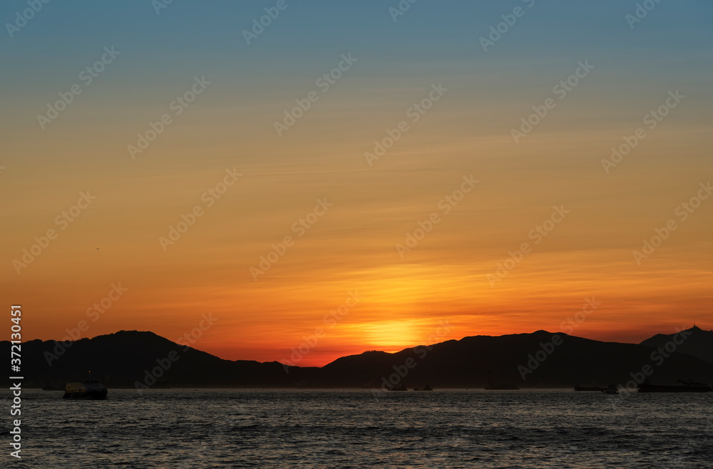 Idyllic landscape of island in Hong Kong city under sunset