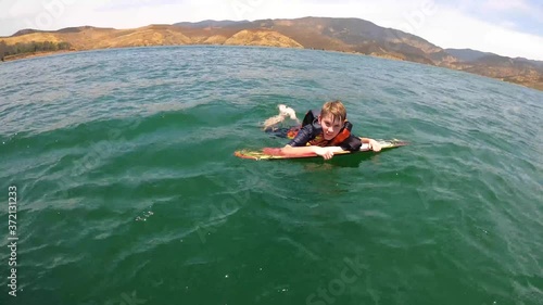 A kid knee boarding at Castaic Lake in California. photo