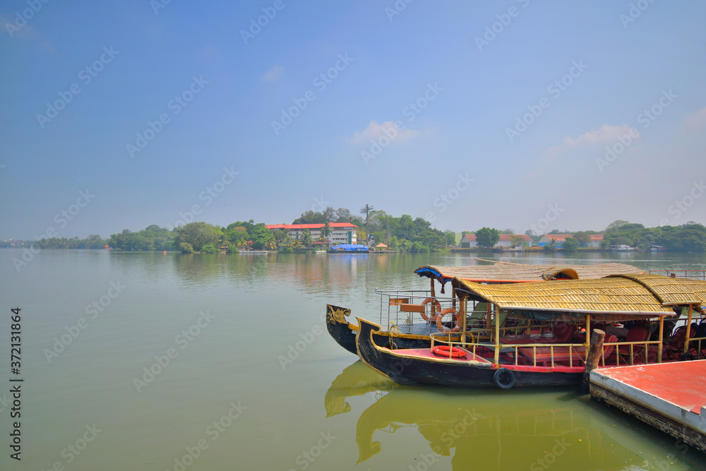 House boat sailing on Ashtamudi lake in kerala backwaters in kollam