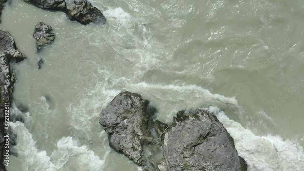 River water splashing close up. Stormy water waves. View from above. Aerial shote River water splashing close up. Stormy water waves. View from above. Aerial shote