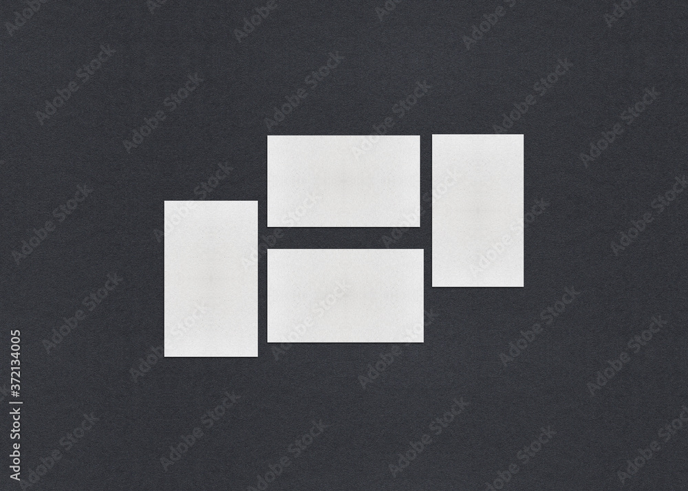 Blank white Business card mockup stacks on grey textured paper background. Blank white Business card mockup stacks on grey textured paper background.