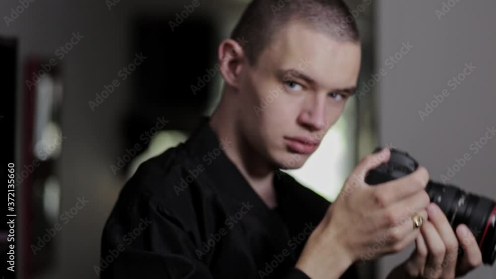 Male Photographer Taking Pictures Inside The House With A DSLR Camera - medium shot Male Photographer Taking Pictures Inside The House With A DSLR Camera - medium shot