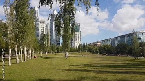 Parque Mujeres, Buenos Aires, Argentina. Peaceful Green Oasis in Modern District on Sunny Day photo