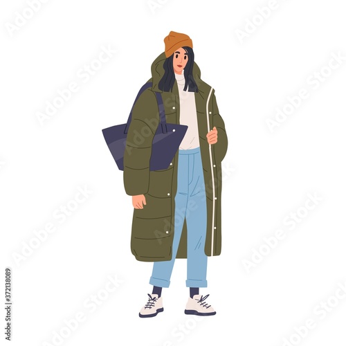 Trendy young woman in warm down jacket and hat vector flat illustration. Stylish female demonstrate street style fashion isolated on white. Modern girl in winter, spring or autumn clothing