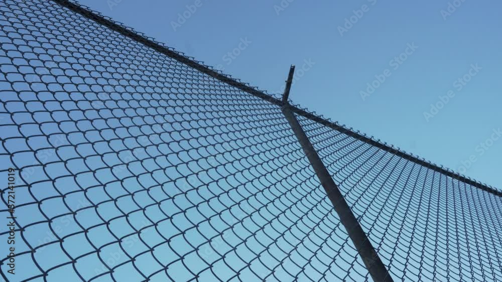 Low Angle View of Alcatraz Prison Fence and Blue Sky Background, San Francisco, California USA Low Angle View of Alcatraz Prison Fence and Blue Sky Background, San Francisco, California USA