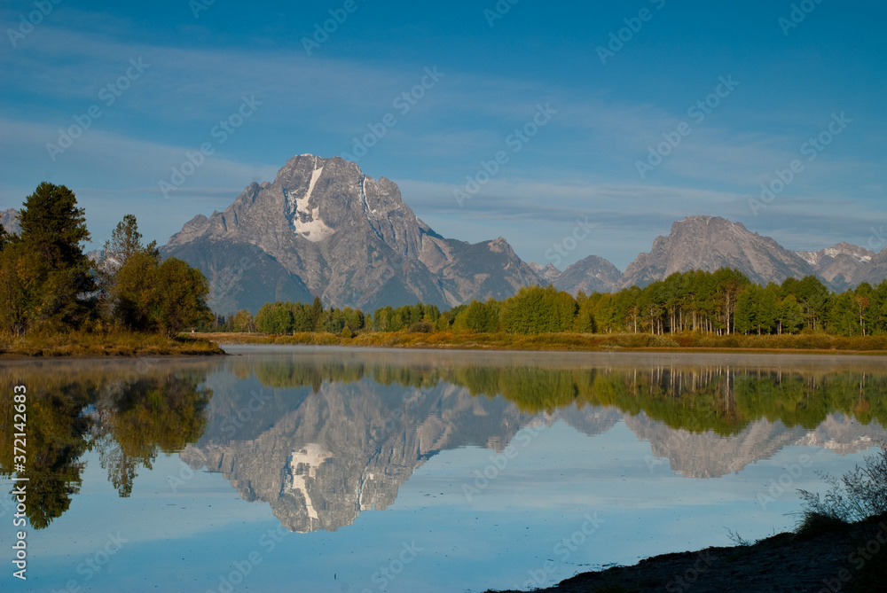 reflection in the lake of Mountain Tetons National Park