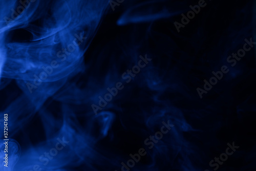 Blue steam on a black background.