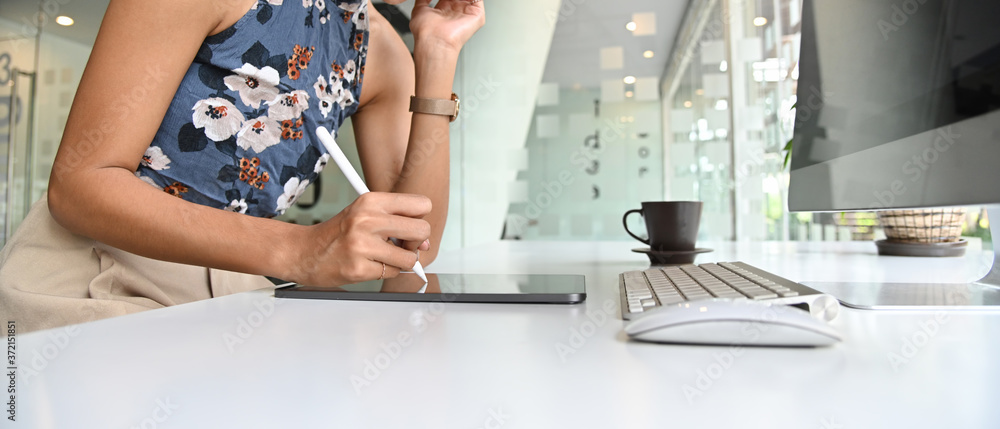 Close up image of business woman working with tablet on white table in office. Close up image of business woman working with tablet on white table in office.