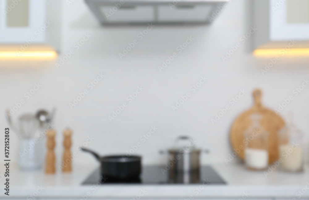 Blurred view of modern kitchen with stove Blurred view of modern kitchen with stove