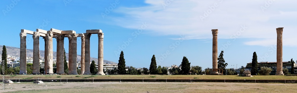 Panoramic view of The Temple of Olympian Zeus , an important ancient temple in central Athens. Sunny day, blue sky with clouds