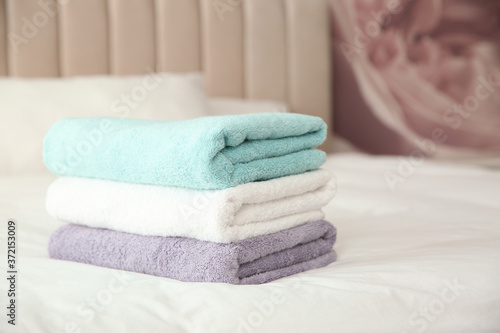 Soft clean towels on bed at home © New Africa