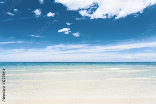 Turquoise blue sea with white sand and sunny sky in summer with copy space