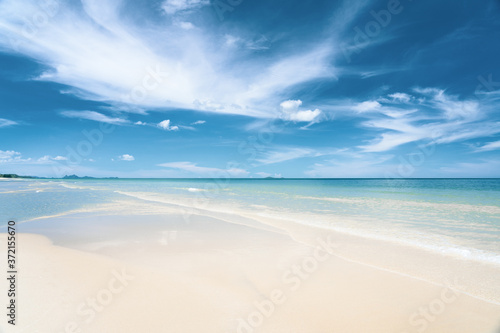 Turquoise blue sea with white sand and sunny sky in summer with copy space © Danai