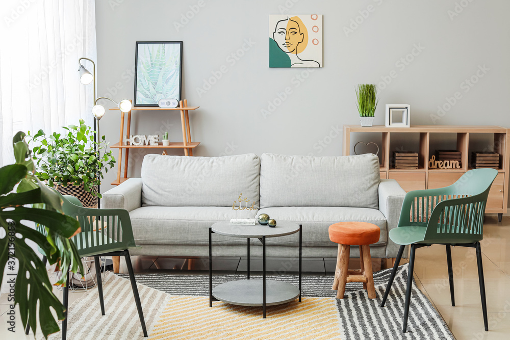 Fototapeta premium Stylish interior of living room with sofa