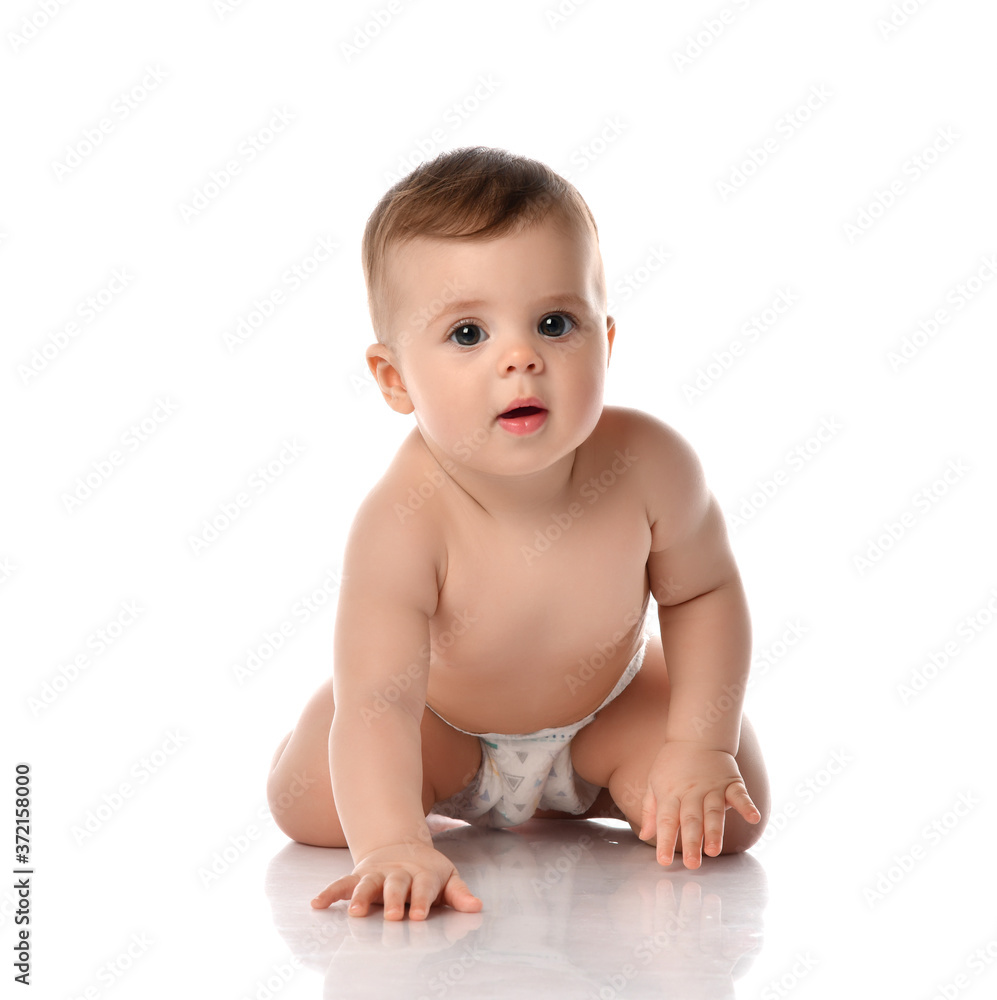 Curious infant baby toddler naked in diaper is crawling toward us on all fours moving Curious infant baby toddler naked in diaper is crawling toward us on all fours moving