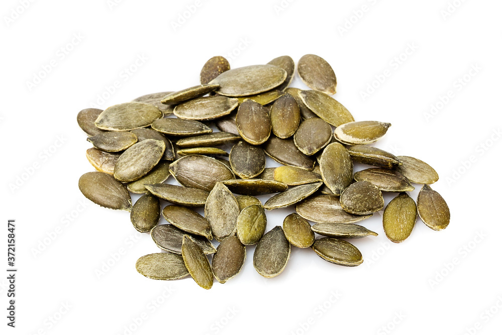 Close up of Pumpkin seeds isolated on white background Close up of Pumpkin seeds isolated on white background