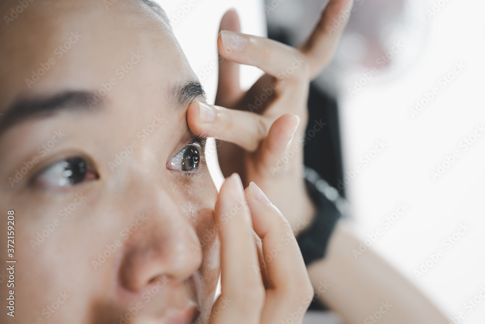 Contact Lens For Vision. Closeup Of Female Face With Applying Contact Lens On Her Eyes. Beautiful Woman Putting Eye Lenses With Hands. Opthalmology Medicine And Health. Contact Lens For Vision. Closeup Of Female Face With Applying Contact Lens On Her Eyes. Beautiful Woman Putting Eye Lenses With Hands. Opthalmology Medicine And Health.