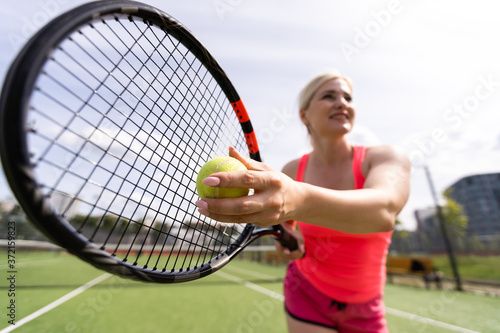 Woman playing tennis and waiting for the service © Angelov