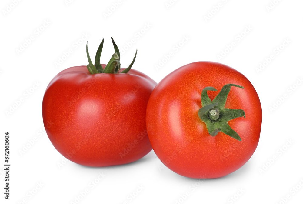 Tasty ripe tomatoes with leaves isolated on white Tasty ripe tomatoes with leaves isolated on white