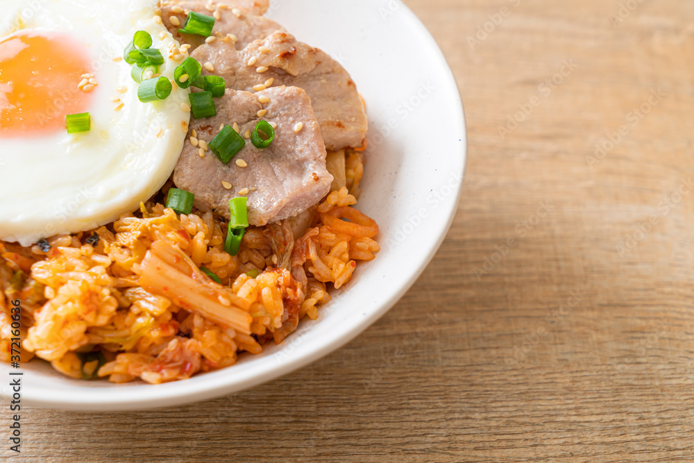 Kimchi fried rice with fried egg and pork Kimchi fried rice with fried egg and pork
